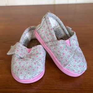 Tom’s pink and grey polka dotted shoes for baby